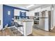 Modern kitchen with stainless steel appliances and a breakfast bar at 1890 Colony Dr. # 17-G, Surfside Beach, SC 29575