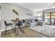 Spacious living area with L-shaped sofa and dining table at 1890 Colony Dr. # 17-G, Surfside Beach, SC 29575