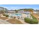 Community pool with surrounding lounge chairs at 1890 Colony Dr. # 17-G, Surfside Beach, SC 29575