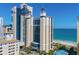 Oceanfront resort building with beach and surrounding buildings in view at 2004 N Ocean Blvd. # 1472, Myrtle Beach, SC 29572