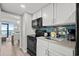 Clean kitchen featuring white cabinets and black appliances at 2004 N Ocean Blvd. # 1472, Myrtle Beach, SC 29572