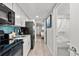 Modern kitchen with black appliances and teal accents at 2004 N Ocean Blvd. # 1472, Myrtle Beach, SC 29572