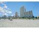 Open beach view with condo buildings and vacationers at 2504 North Ocean Blvd. # 436, Myrtle Beach, SC 29577
