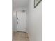 A white entry door with security features in a hallway setting at 2504 North Ocean Blvd. # 436, Myrtle Beach, SC 29577