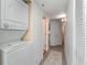 Hallway with a washer-dryer unit and a laundry closet at 2504 North Ocean Blvd. # 436, Myrtle Beach, SC 29577