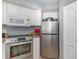 Clean, efficient kitchen with stainless steel appliances and sleek white cabinetry at 2504 North Ocean Blvd. # 436, Myrtle Beach, SC 29577