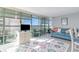 Living room with floor-to-ceiling windows, contemporary furnishings, and views from the balcony at 2504 North Ocean Blvd. # 436, Myrtle Beach, SC 29577