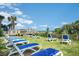 Serene oceanfront lounge area on a grassy lawn with white and blue lounge chairs at 2504 North Ocean Blvd. # 436, Myrtle Beach, SC 29577