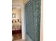 Small bathroom with shower/tub and patterned shower curtain at 2710 Ocean Blvd. S # 406, Myrtle Beach, SC 29577
