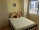 Comfortable bedroom with built-in cabinets and a murphy bed at 2710 Ocean Blvd. S # 406, Myrtle Beach, SC 29577