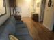 Living area with a sofa, hardwood floors, and view of kitchen at 2710 Ocean Blvd. S # 406, Myrtle Beach, SC 29577
