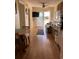 Open living room with kitchen, hardwood floors, and access to a balcony at 2710 Ocean Blvd. S # 406, Myrtle Beach, SC 29577