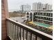 View from balcony overlooking the community pool and nearby buildings at 2710 Ocean Blvd. S # 406, Myrtle Beach, SC 29577