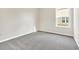An empty bedroom featuring a window and neutral carpeting at 287 Palmetto Sand Loop, Conway, SC 29527