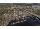 Aerial view of waterfront properties, dock, and highway over the water at 301 Crossing Ct., Myrtle Beach, SC 29588