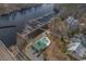 Aerial view of a waterfront community featuring a community pool and boat docks on a scenic river at 301 Crossing Ct., Myrtle Beach, SC 29588