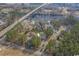 Aerial neighborhood view of several homes, ponds, mature trees, and waterway at 301 Crossing Ct., Myrtle Beach, SC 29588