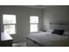 Main bedroom with lake view, plush bed, and ample closet space at 325 Golan Circle # 12B, Myrtle Beach, SC 29579