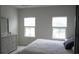 Main bedroom with lake view, plush bed, and ample closet space at 325 Golan Circle # 12B, Myrtle Beach, SC 29579