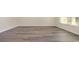 Spacious living room with modern gray wood-look flooring and ample natural light at 3450 Ashridge Way, Conway, SC 29526