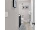 Bathroom featuring a dark vanity, toilet, tile floors, and decorative wall art at 415 Ocean Creek Dr. # 2139, Myrtle Beach, SC 29572