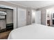 Neutral bedroom featuring walk-in closet, wood floors, and access to bathroom and hallway at 415 Ocean Creek Dr. # 2139, Myrtle Beach, SC 29572