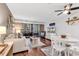 Comfortable living room with hardwood floors, natural light, and sliding glass door to balcony at 415 Ocean Creek Dr. # 2139, Myrtle Beach, SC 29572