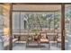Screened patio with wicker furniture and views of trees, nature, and landscape at 415 Ocean Creek Dr. # 2139, Myrtle Beach, SC 29572
