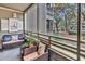Screened porch offering relaxing seating and views of mature landscaping at 415 Ocean Creek Dr. # 2139, Myrtle Beach, SC 29572
