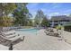 Outdoor pool with lounge chairs and landscaped deck area at 415 Ocean Creek Dr. # 2139, Myrtle Beach, SC 29572