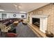 Relaxing basement with a fireplace and a curved leather sectional sofa at 462 Mohican Dr., Georgetown, SC 29440