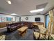Spacious finished basement with leather seating and a large TV at 462 Mohican Dr., Georgetown, SC 29440