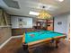 Game room with a pool table and brick accent wall at 462 Mohican Dr., Georgetown, SC 29440