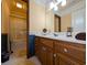 Clean bathroom with wood vanity and bathtub at 462 Mohican Dr., Georgetown, SC 29440