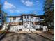 Two-story house with brick facade, white railings, and a double staircase at 462 Mohican Dr., Georgetown, SC 29440