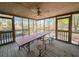 Enjoy the outdoors in this screened porch with table and seating at 462 Mohican Dr., Georgetown, SC 29440