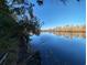 Serene view of calm water and lush vegetation at 462 Mohican Dr., Georgetown, SC 29440
