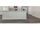 Kitchen island with granite countertop and white cabinets at 5800 Ellisridge Ct, Conway, SC 29526