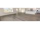 Open floor plan with kitchen, living area, and luxury vinyl flooring at 5800 Ellisridge Ct, Conway, SC 29526