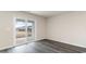 Bright living room featuring sliding glass doors and modern wood-look flooring at 5801 Ellisridge Ct, Conway, SC 29526