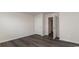 A cozy bedroom with hardwood floors and a view of a white interior door at 5805 Ellisridge Ct, Conway, SC 29526