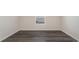 Bedroom showcasing gray luxury vinyl plank flooring and a small window at 5805 Ellisridge Ct, Conway, SC 29526
