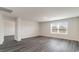 Bright living room with sleek, modern flooring, a large window, and neutral paint at 5805 Ellisridge Ct, Conway, SC 29526