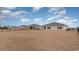 Row of homes with a large dry backyard and black fencing under a cloudy blue sky at 5810 Ellisridge Ct, Conway, SC 29526