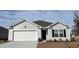 Charming one-story home showcasing a white garage door, blue shutters, and light gray vinyl siding at 6000 Fuller Ridge Ct, Conway, SC 29526