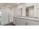 Modern bathroom featuring granite countertops, dual sinks, and glass-enclosed shower at 6008 Fuller Ridge Ct, Conway, SC 29526
