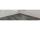 Corner view of gray floors, white walls, and baseboards in a room with a window at 6008 Fuller Ridge Ct, Conway, SC 29526