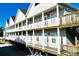 Condo building's exterior, showcasing multiple units and balconies at 613 Sea Mountain Hwy. # 128, North Myrtle Beach, SC 29582