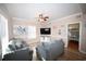 Beach-themed living room with sectional sofa and large TV at 613 Sea Mountain Hwy. # 128, North Myrtle Beach, SC 29582