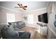 Beach-themed living room with sectional sofa and large TV at 613 Sea Mountain Hwy. # 128, North Myrtle Beach, SC 29582